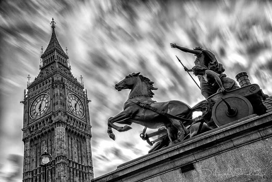 Big Ben and horse statue with clouds in black and white